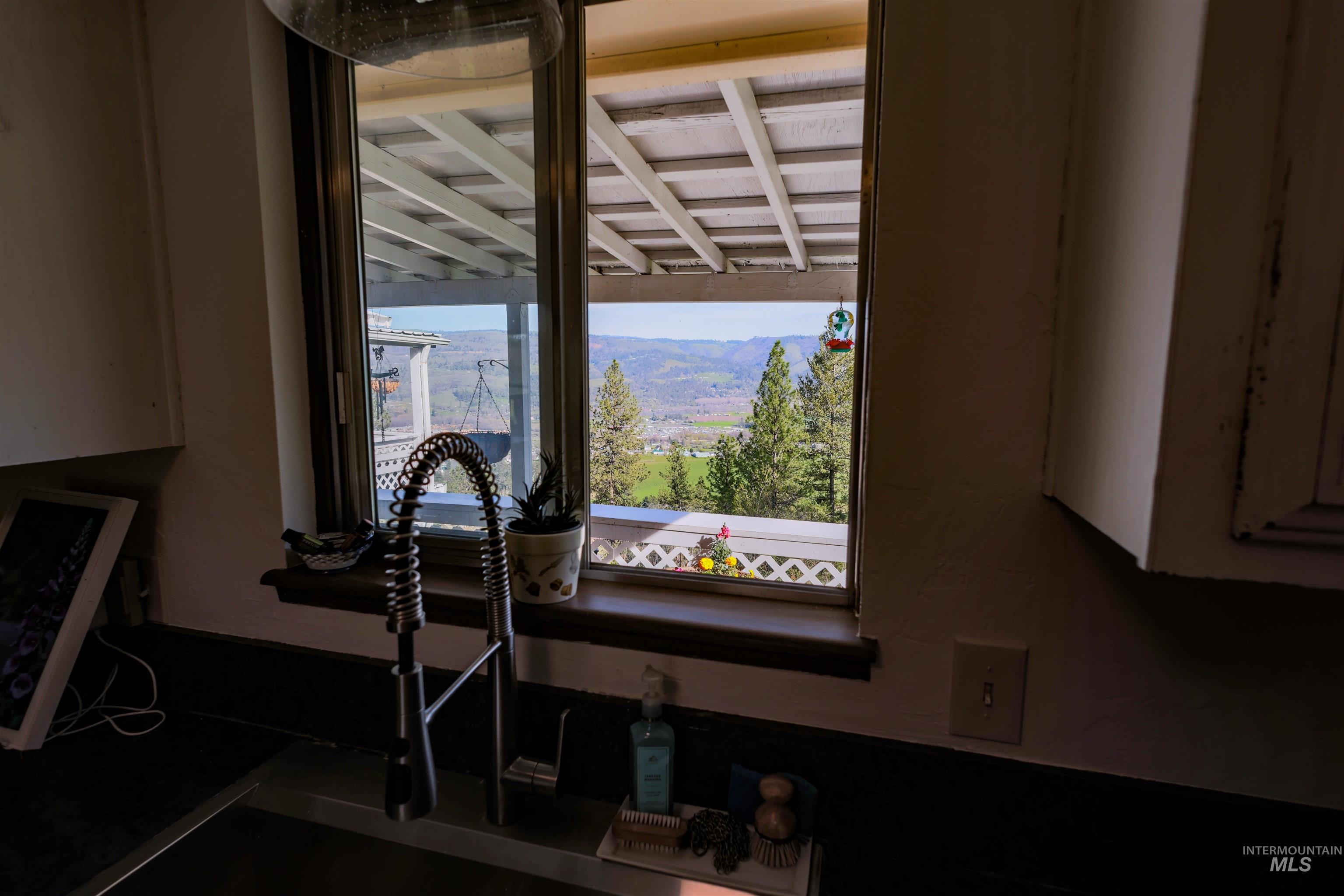 3230 Highway 64 Kamiah, ID 83536 - Photo 38 of 50 Kitchen view of mountains and white cabinets