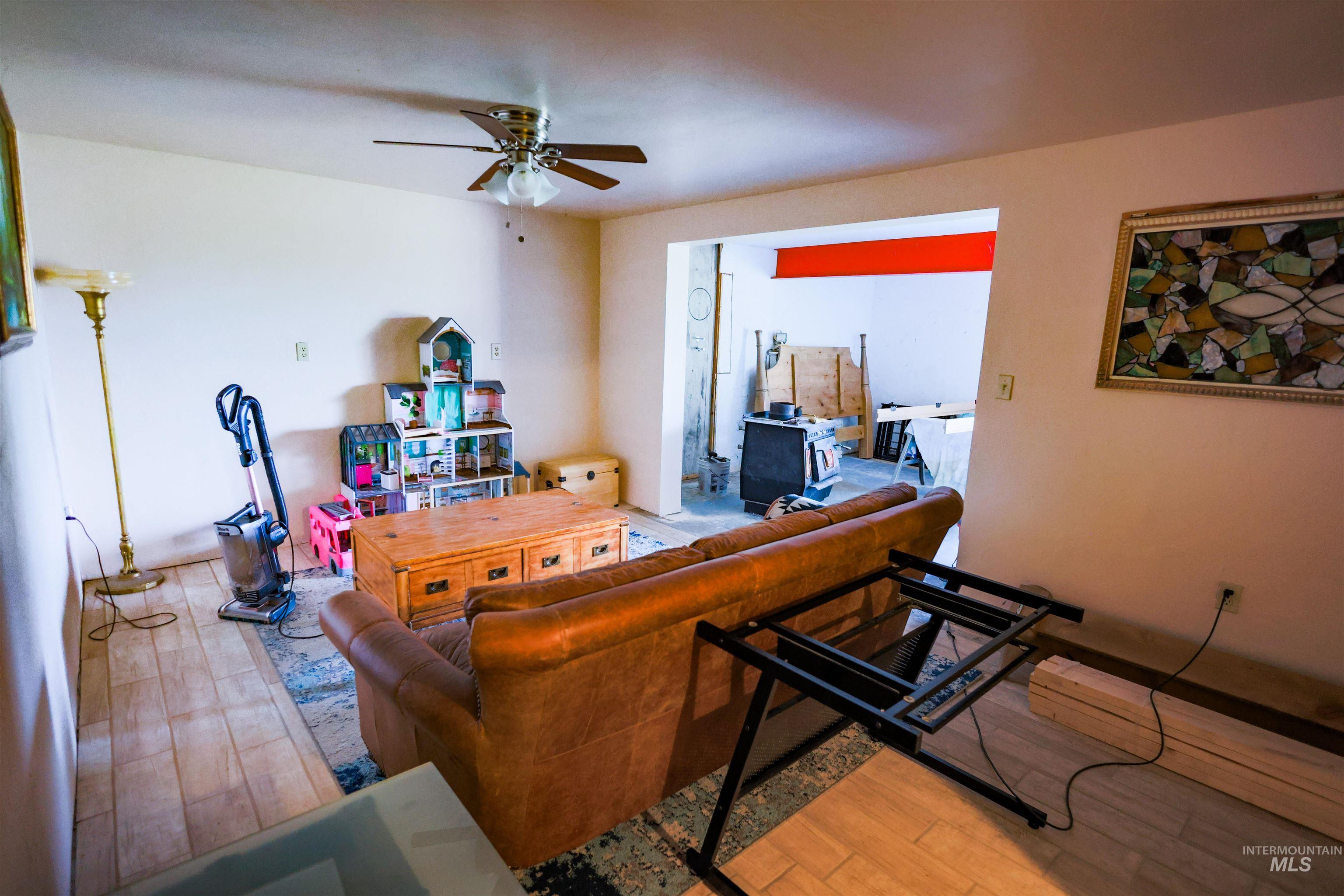 3230 Highway 64 Kamiah, ID 83536 - Photo 45 of 50 Living room with light wood-style floors and a ceiling fan