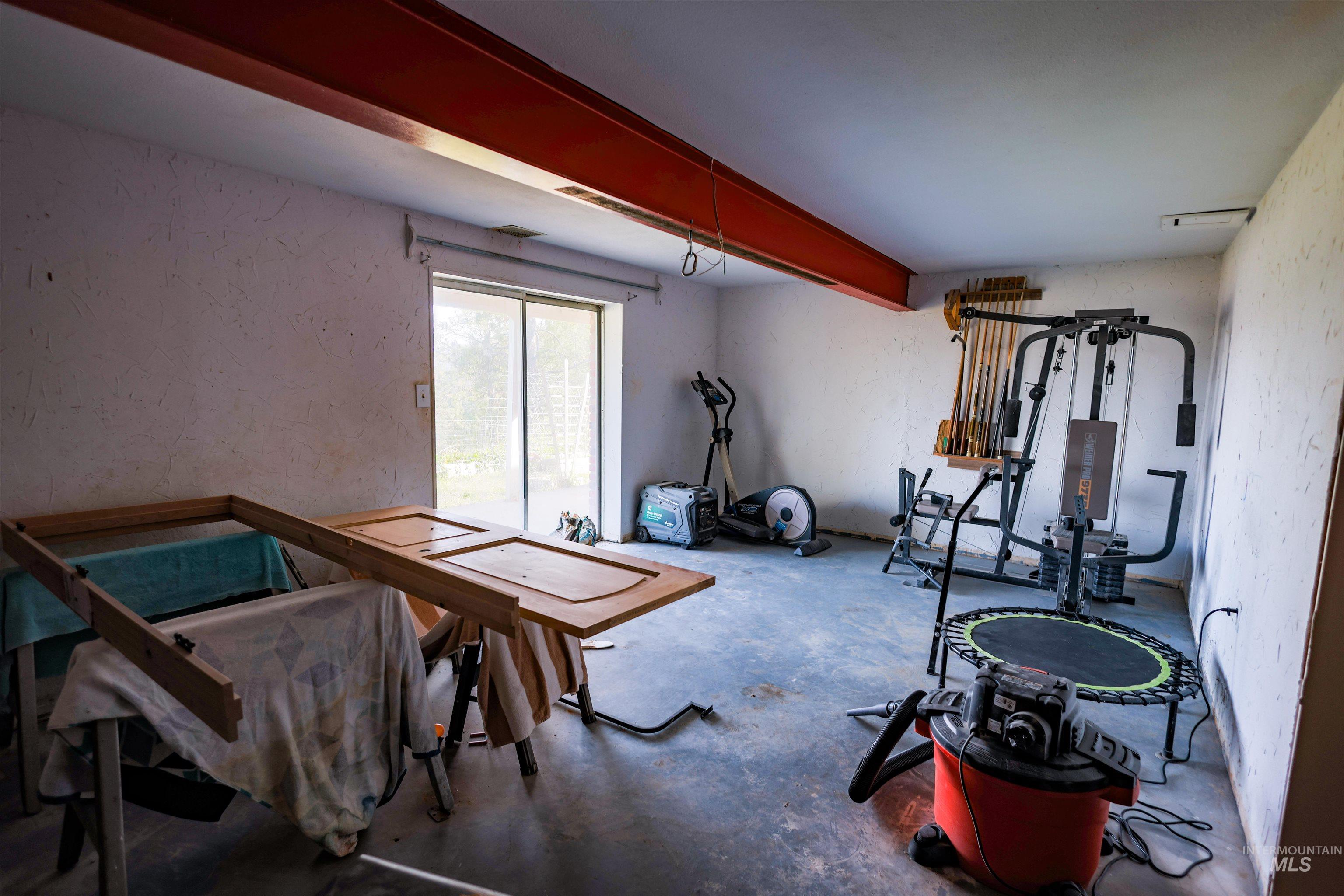3230 Highway 64 Kamiah, ID 83536 - Photo 47 of 50 Workout area with a textured wall and concrete flooring