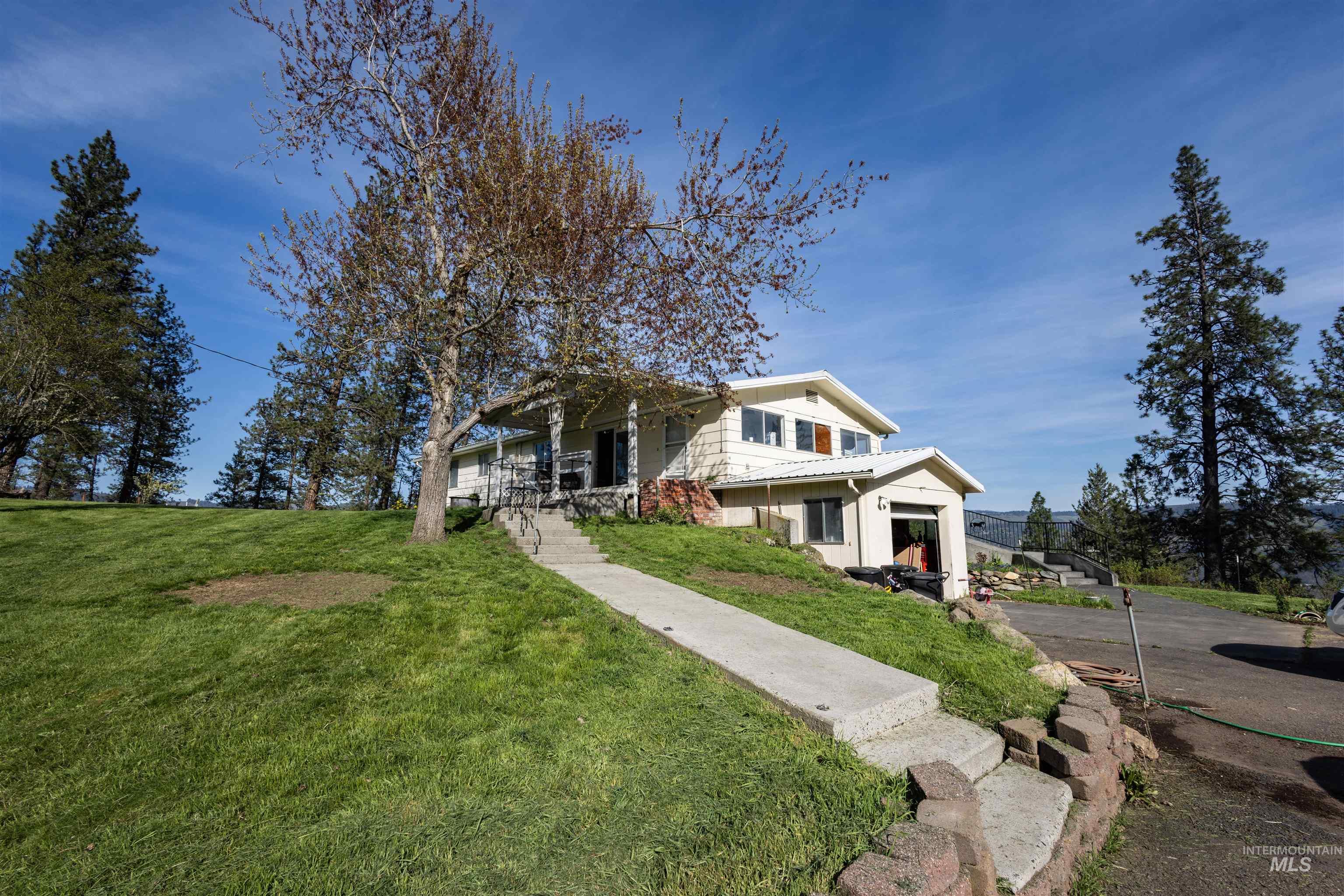 3230 Highway 64 Kamiah, ID 83536 - Photo 10 of 50 View of front facade with a front lawn and a porch