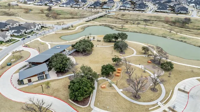 a view of a swimming pool with a yard