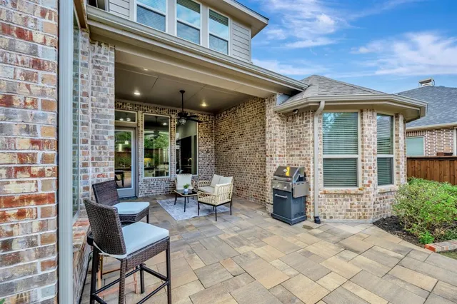 a front view of a house with outdoor seating