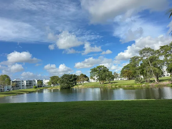 a view of a lake with houses in the back
