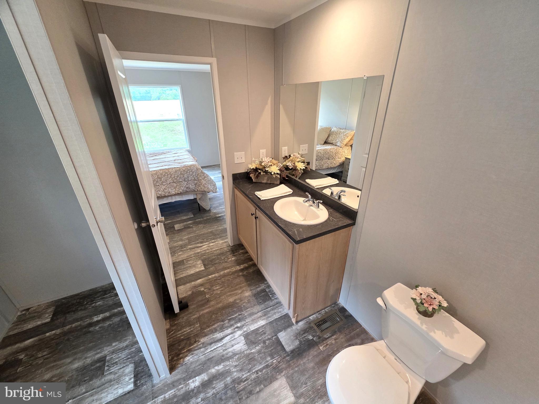 289 Grove Neck Road Earleville, MD 21919 - Photo 11 of 19 a bathroom with a sink toilet and mirror