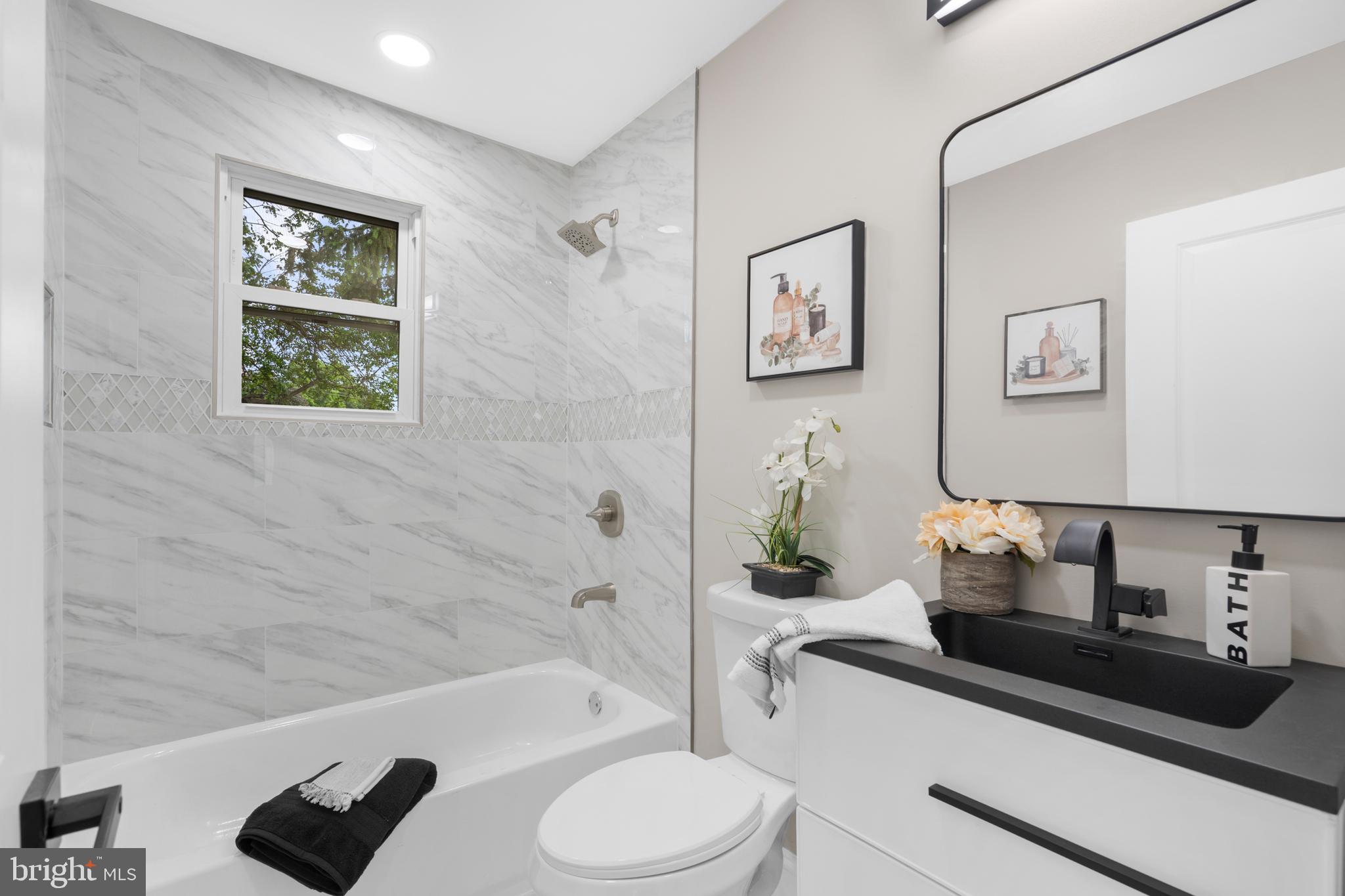 1 Gainor Avenue Maple Shade, NJ 08052 - Photo 15 of 27 a bathroom with a sink a toilet and bathtub