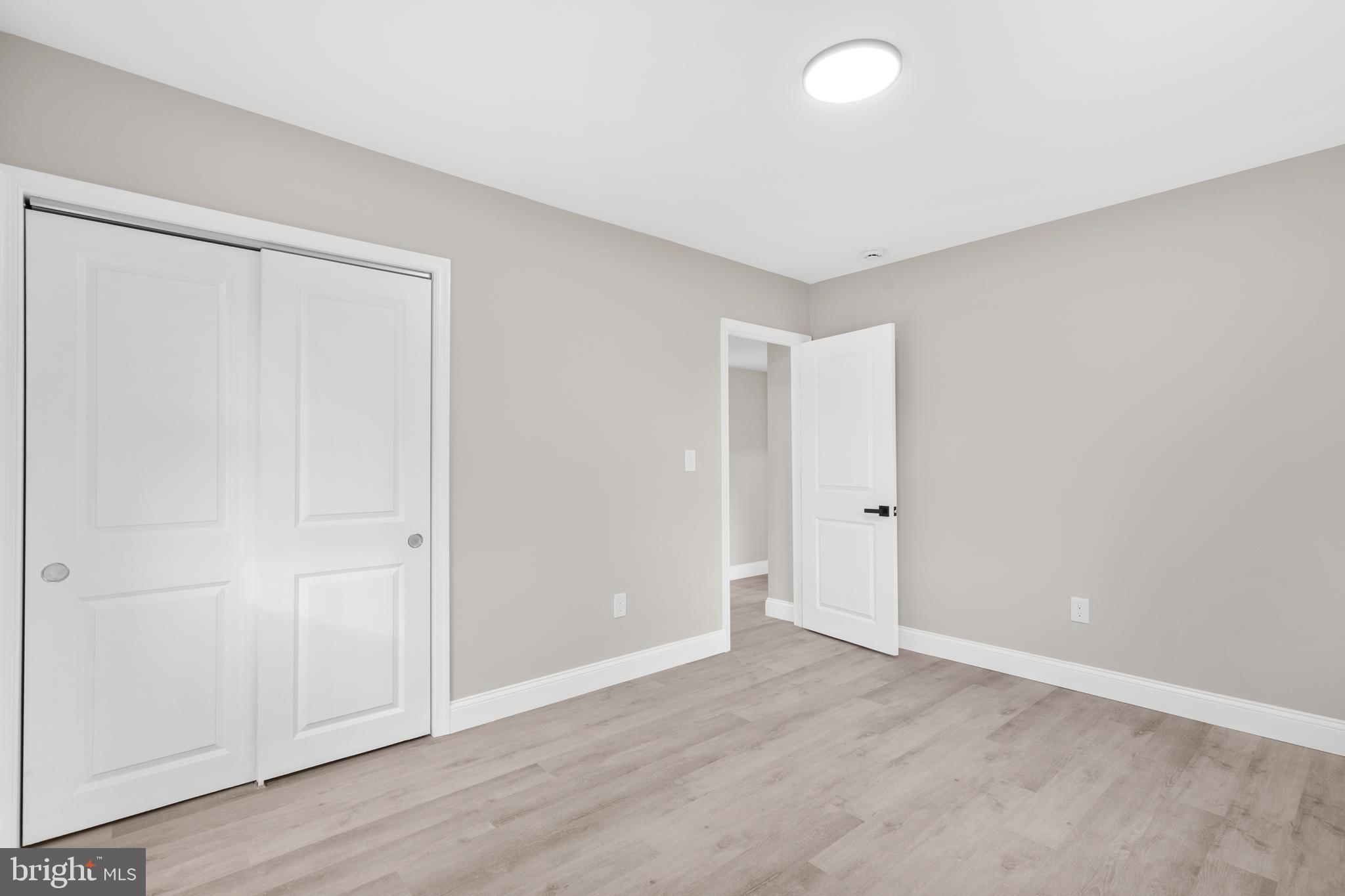 1 Gainor Avenue Maple Shade, NJ 08052 - Photo 19 of 27 an empty room with wooden floor and closet