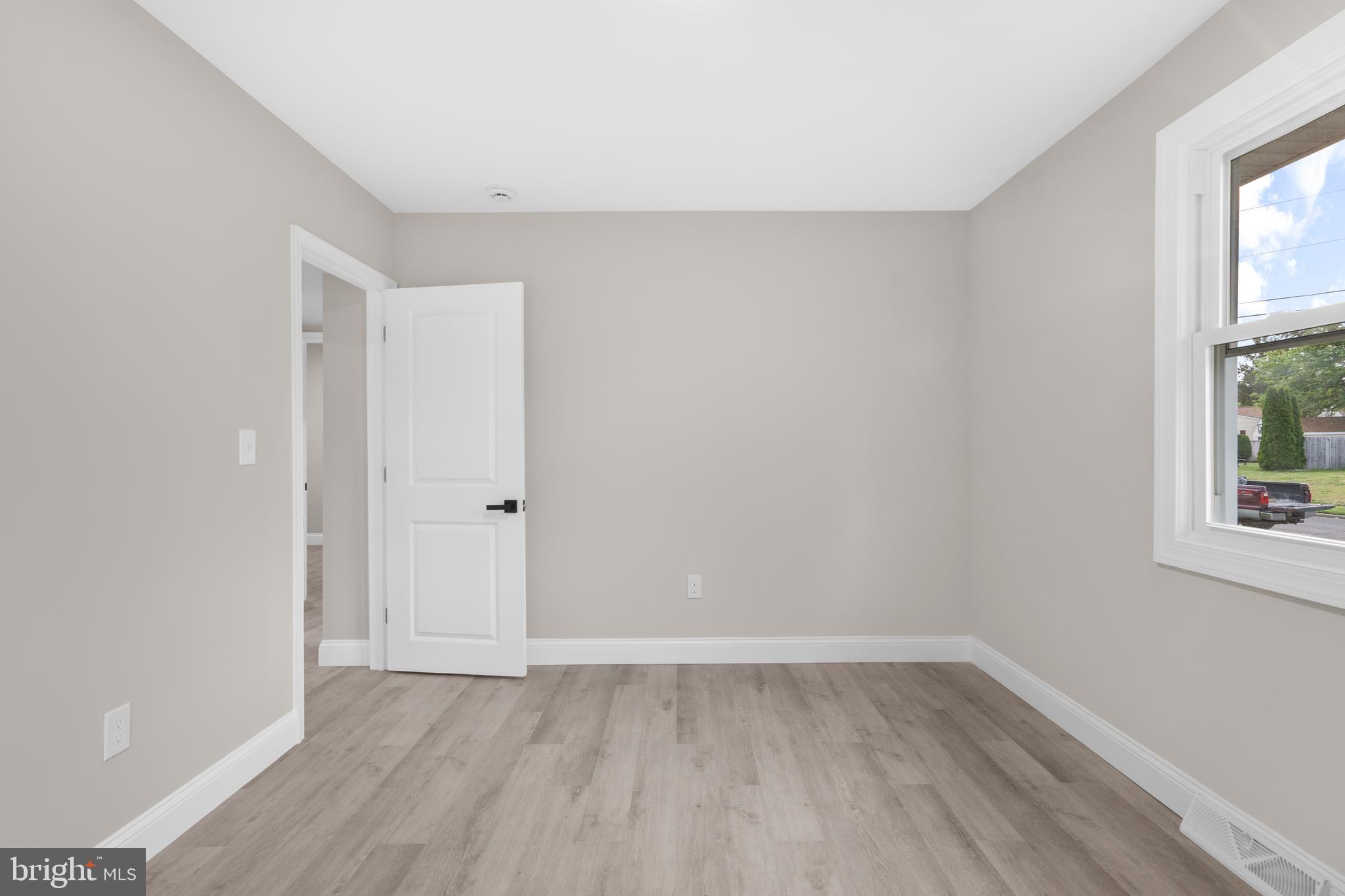 1 Gainor Avenue Maple Shade, NJ 08052 - Photo 20 of 27 a view of an empty room with wooden floor and a window