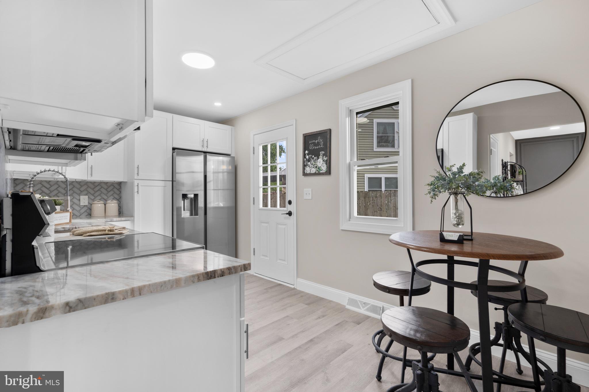 1 Gainor Avenue Maple Shade, NJ 08052 - Photo 9 of 27 a living room with furniture and a chandelier