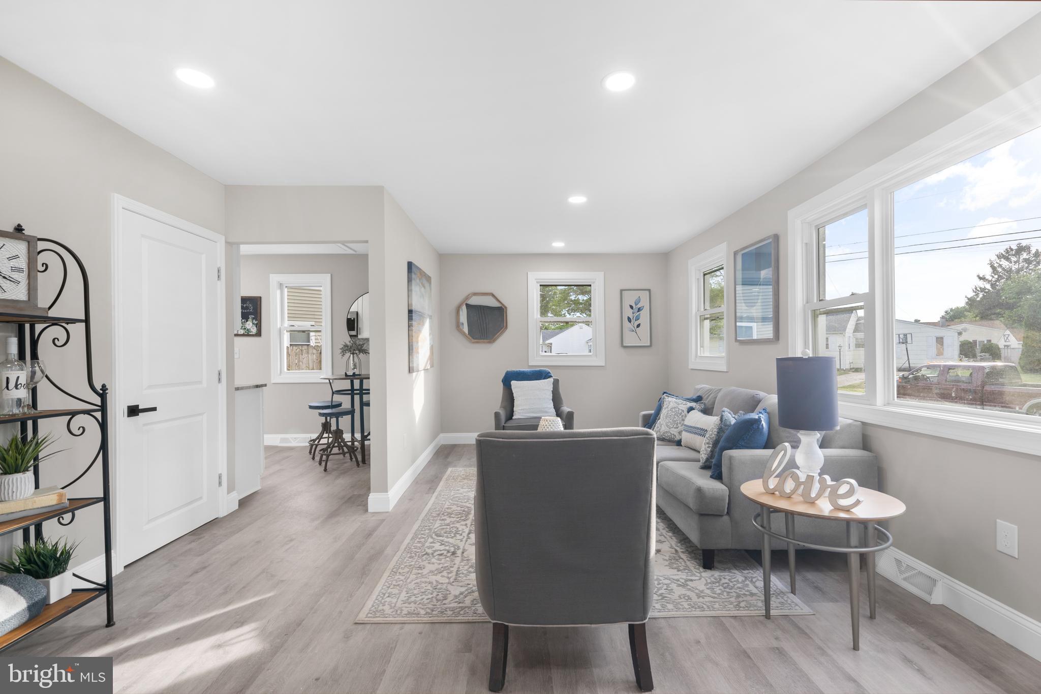1 Gainor Avenue Maple Shade, NJ 08052 - Photo 10 of 27 a living room with furniture a large window and wooden floor