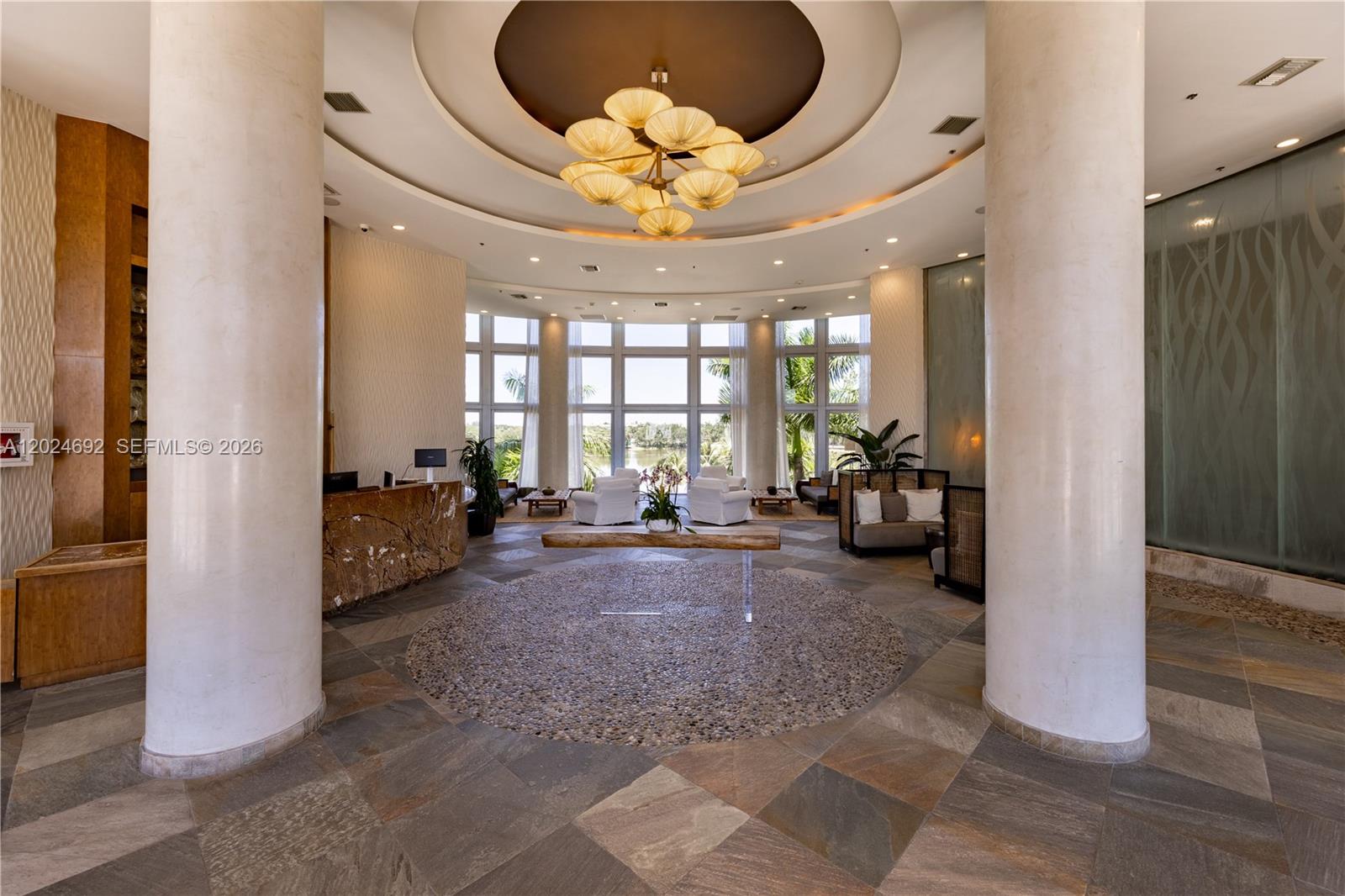 2641 North Flamingo Road, Unit 2605N Sunrise, FL 33323 - Photo 24 of 56 a view of a livingroom with entryway and furniture