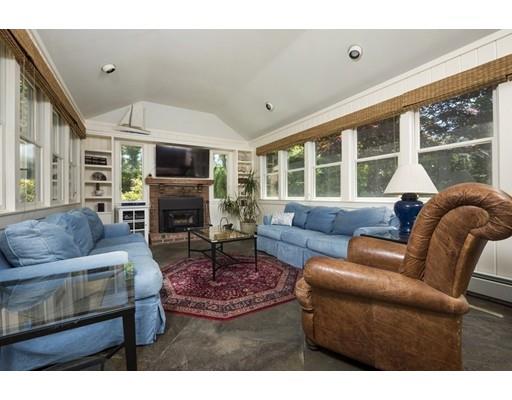 45 Gibson Road Orleans, MA 02653 - Photo 11 of 29 a living room with furniture a large window and a fireplace