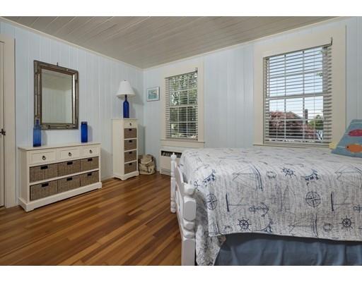 45 Gibson Road Orleans, MA 02653 - Photo 14 of 29 a spacious bedroom with a bed and a flat screen tv