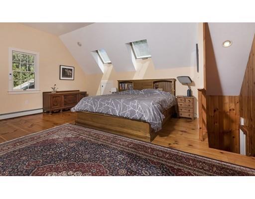 45 Gibson Road Orleans, MA 02653 - Photo 19 of 29 a living room with a couch and a table