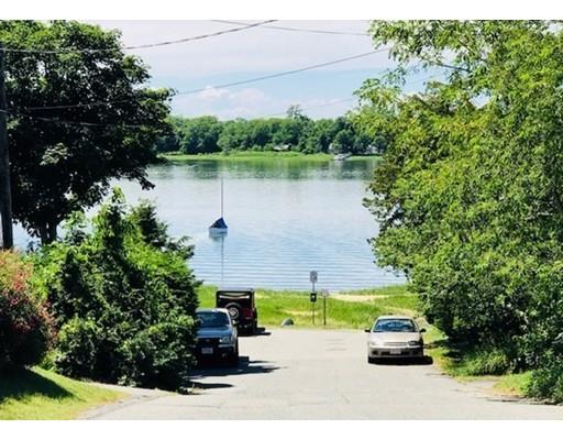 45 Gibson Road Orleans, MA 02653 - Photo 28 of 29 a view of a lake with a house in the background