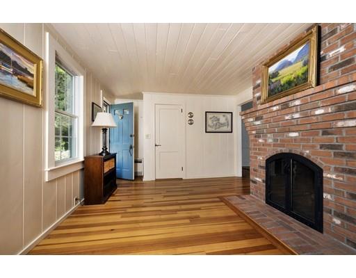 45 Gibson Road Orleans, MA 02653 - Photo 4 of 29 a view of a livingroom with a fireplace