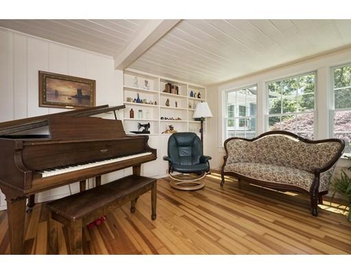 45 Gibson Road Orleans, MA 02653 - Photo 5 of 29 a living room with furniture a fireplace and a window