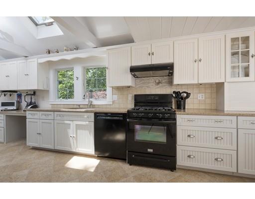 45 Gibson Road Orleans, MA 02653 - Photo 7 of 29 a kitchen with granite countertop a stove a sink and a granite counter tops