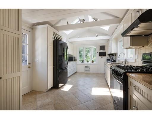 45 Gibson Road Orleans, MA 02653 - Photo 8 of 29 a kitchen with stainless steel appliances granite countertop a refrigerator and a stove top oven