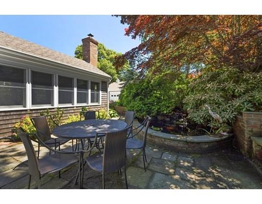 45 Gibson Road Orleans, MA 02653 - Photo 10 of 29 a backyard of a house with table and chairs