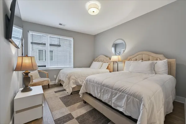 a bedroom with bed and a window