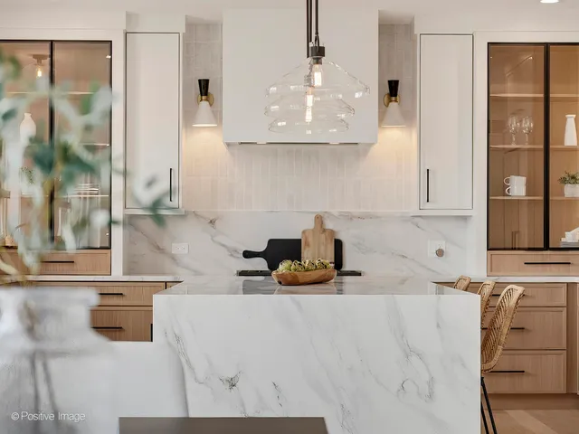 a kitchen with a sink a stove and cabinets