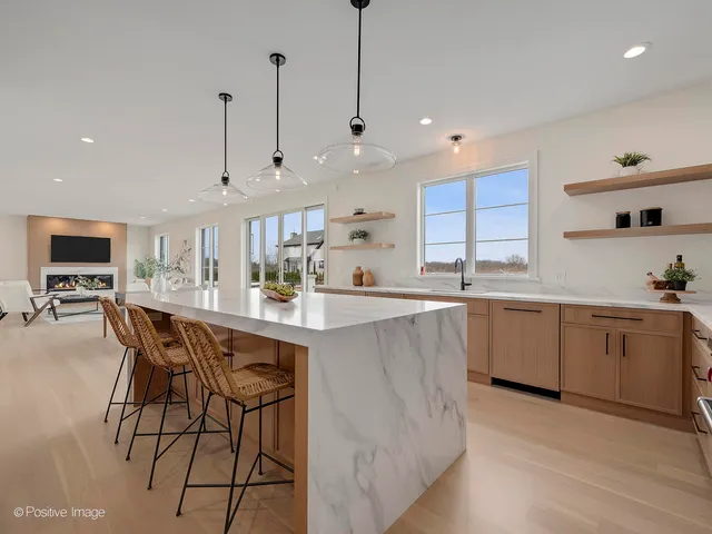 a large kitchen with lots of counter space a sink and appliances