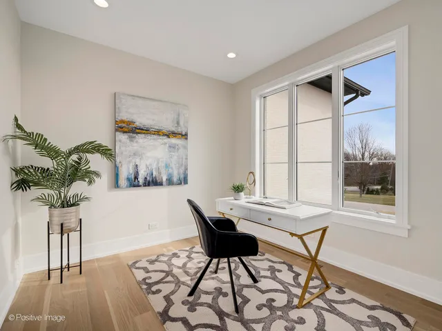 a workspace with furniture and a potted plant