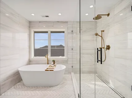 a bathroom with a bathtub and shower