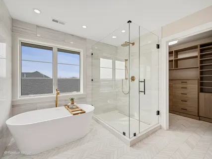 a bathroom with a bathtub and a shower