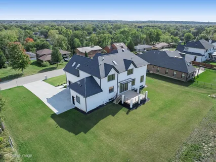 an aerial view of a house with garden