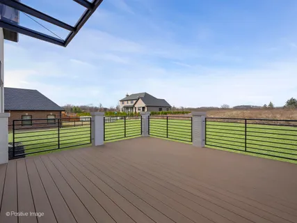 a view of a deck and a yard