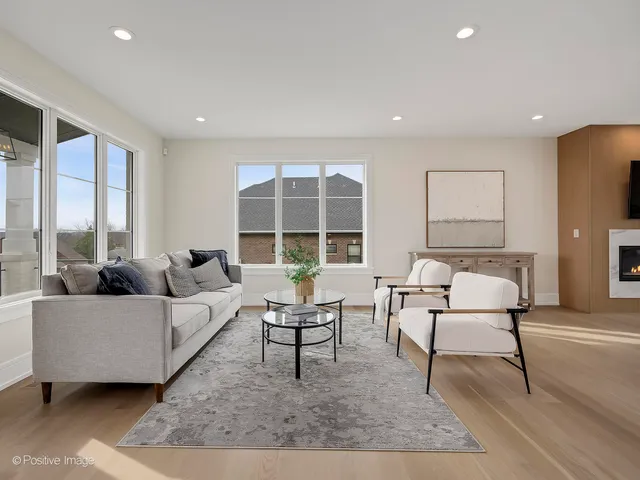 a living room with furniture and a table