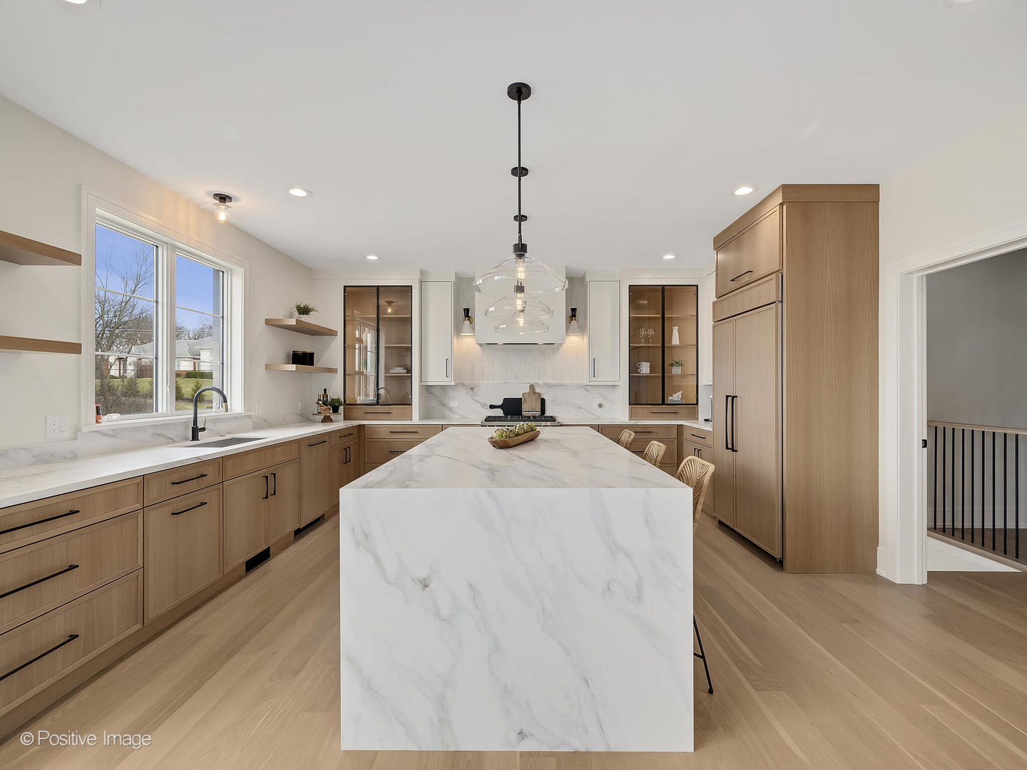 8302 Pleasant View Avenue Willow Springs, IL 60527 - Photo 10 of 45 a large white kitchen with granite countertop a stove a sink dishwasher and a refrigerator with wooden floor
