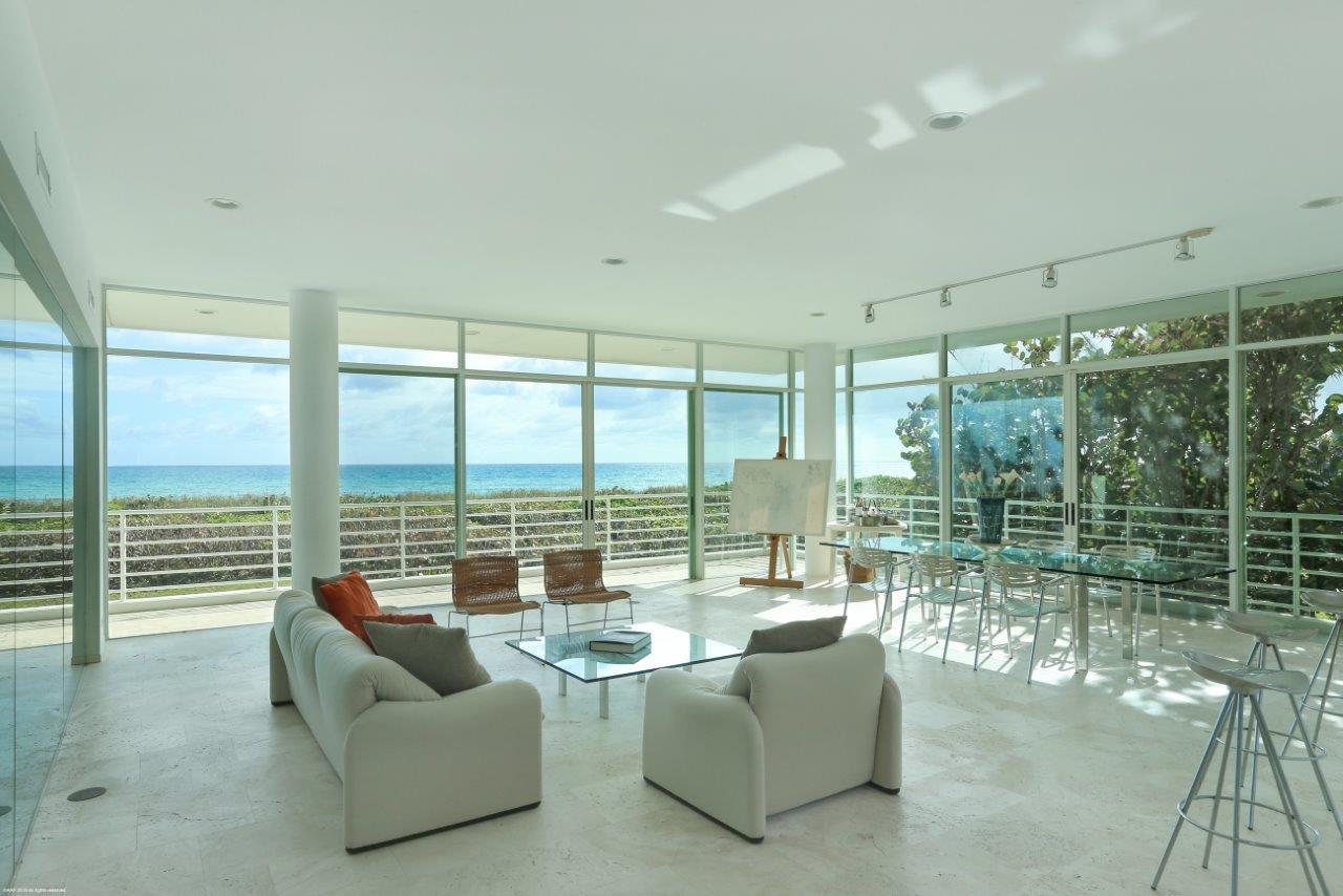 35 North Beach Road Hobe Sound, FL 33455 - Photo 19 of 44 a living room with furniture and floor to ceiling windows