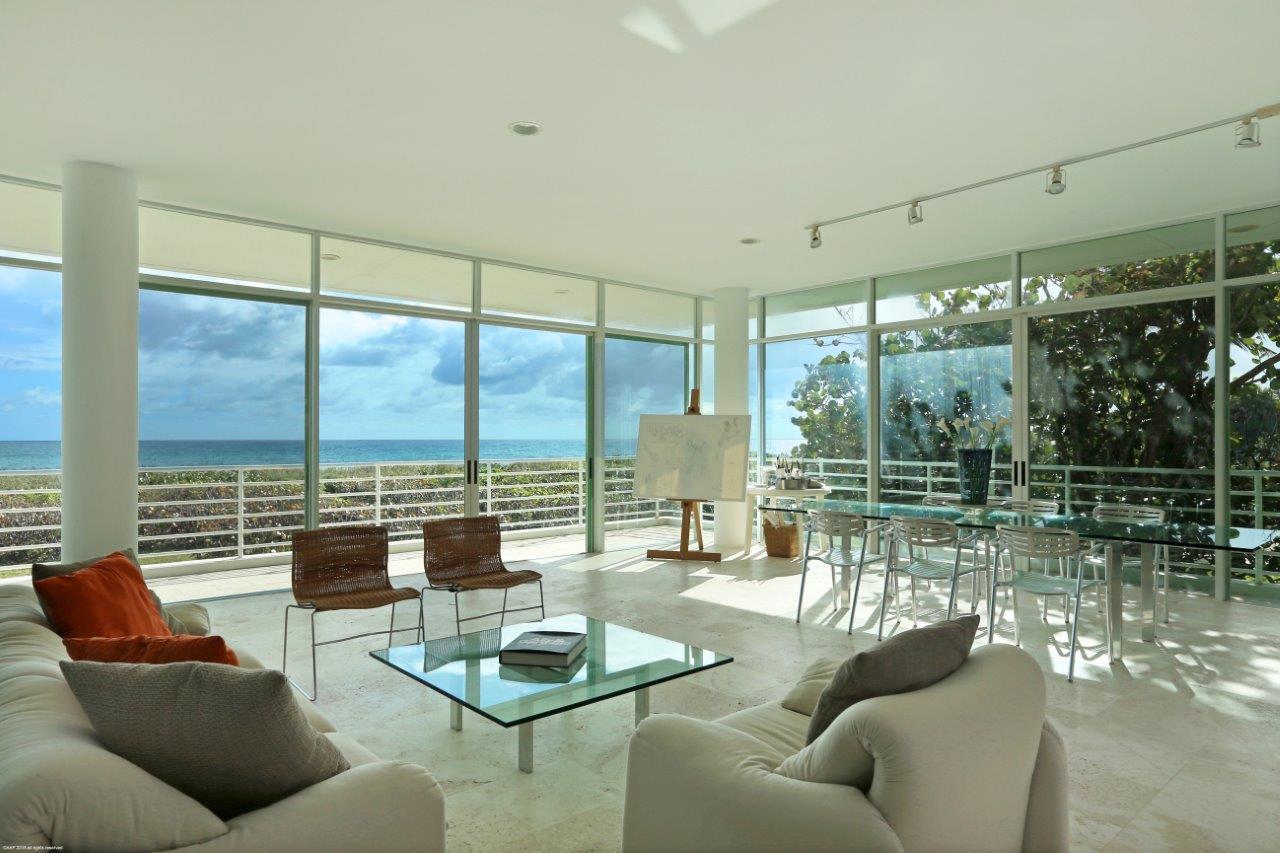 35 North Beach Road Hobe Sound, FL 33455 - Photo 20 of 44 a living room with furniture and a floor to ceiling window