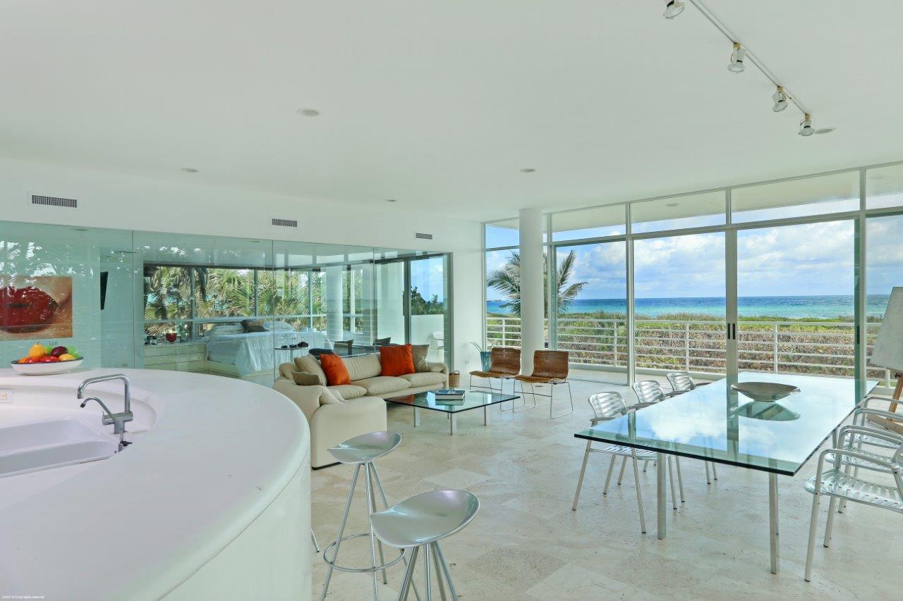 35 North Beach Road Hobe Sound, FL 33455 - Photo 22 of 44 a living room with furniture and a large window