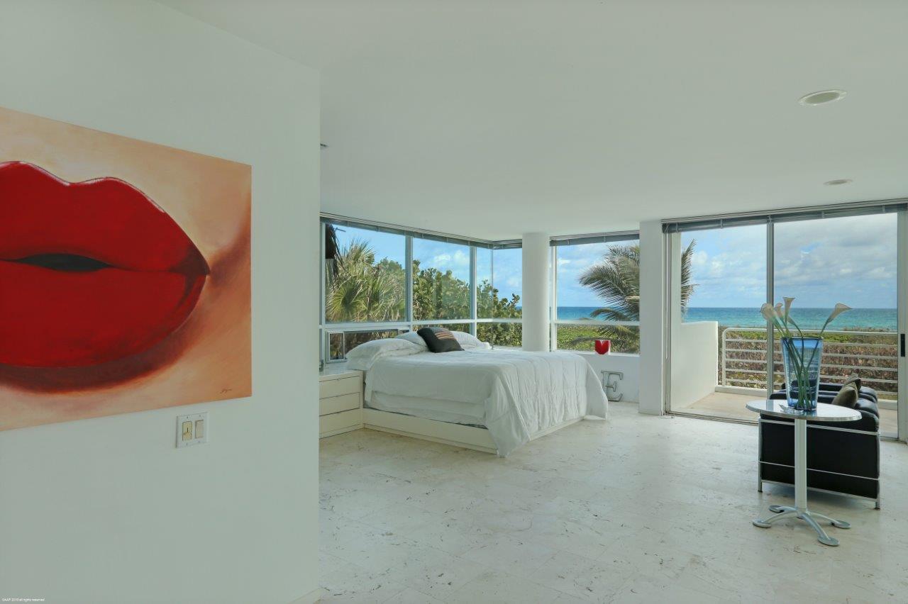 35 North Beach Road Hobe Sound, FL 33455 - Photo 28 of 44 a living room with furniture and a large window
