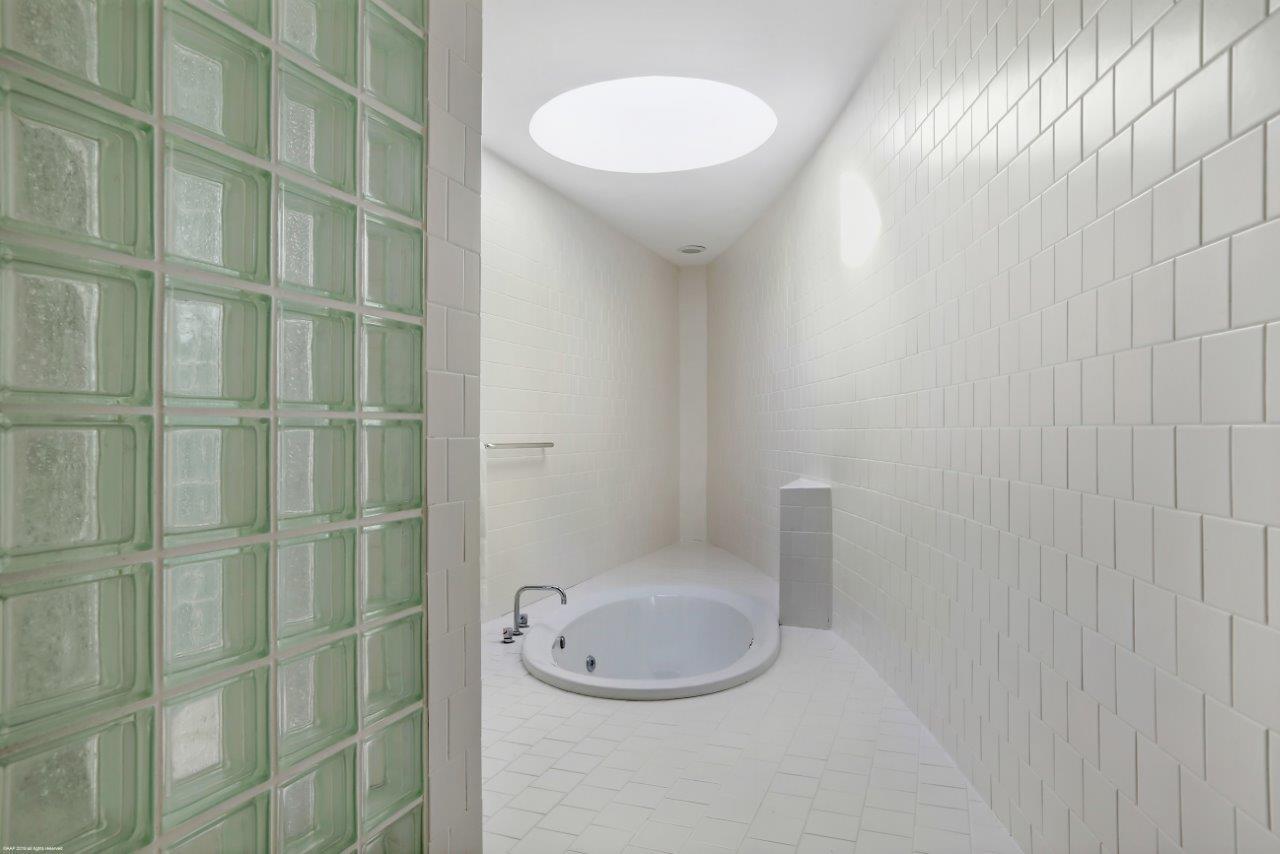35 North Beach Road Hobe Sound, FL 33455 - Photo 29 of 44 a bathroom with a toilet and shower