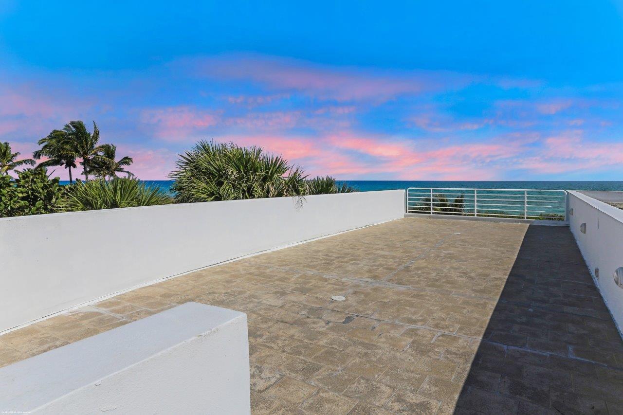 35 North Beach Road Hobe Sound, FL 33455 - Photo 36 of 44 swimming pool view with a garden