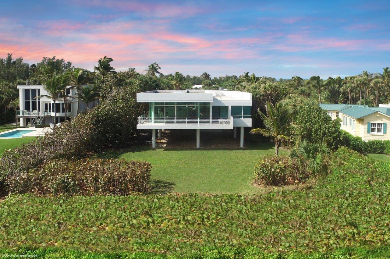 35 North Beach Road Hobe Sound, FL 33455 - Photo 37 of 44 a view of a house with a garden