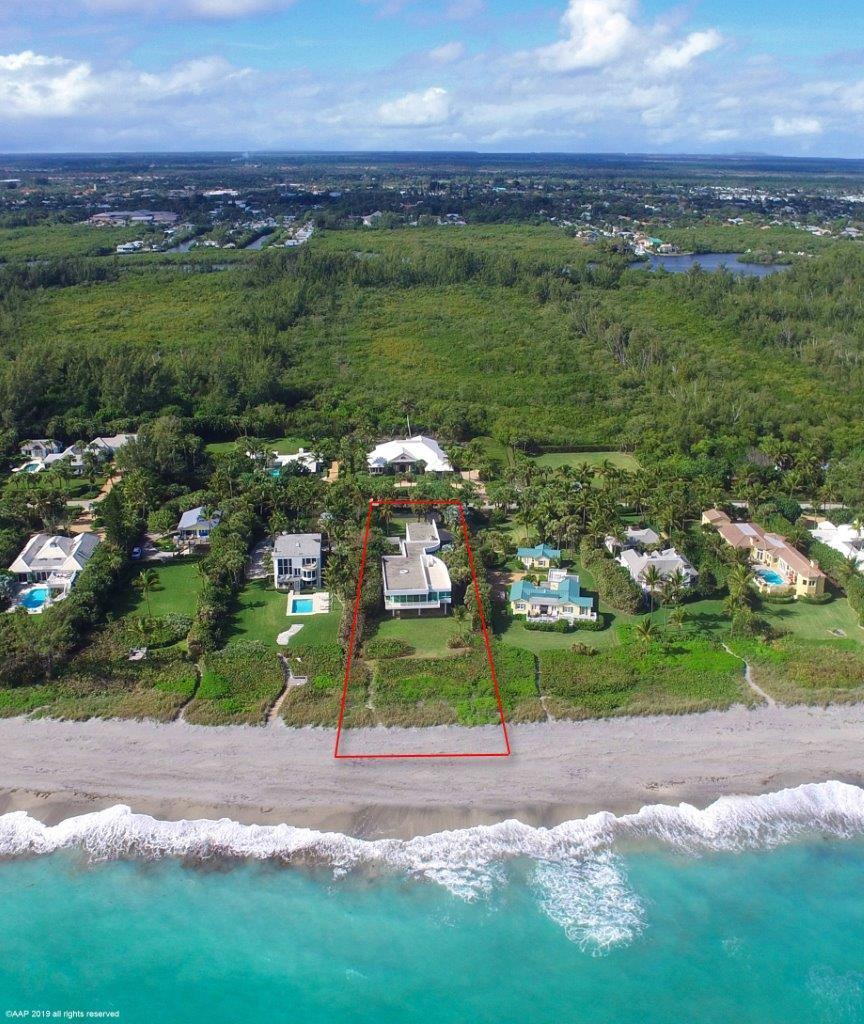 35 North Beach Road Hobe Sound, FL 33455 - Photo 4 of 44 a view of a lake with a city