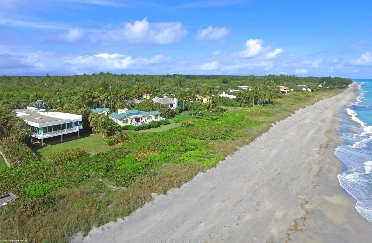 35 North Beach Road Hobe Sound, FL 33455 - Photo 42 of 44 a aerial view of a house with a yard