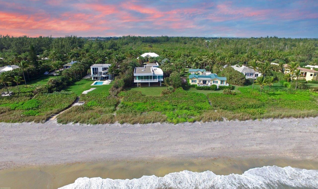 35 North Beach Road Hobe Sound, FL 33455 - Photo 9 of 44 a front view of a house with a lake view