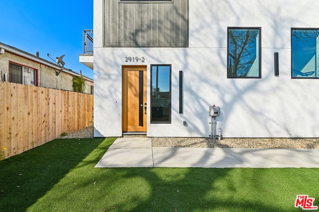 2923 South Burnside Avenue Los Angeles, CA 90016 - Photo 21 of 26 a view of a house with a swimming pool