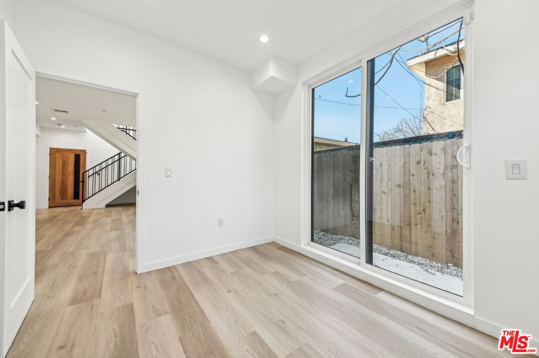 2923 South Burnside Avenue Los Angeles, CA 90016 - Photo 8 of 26 a view of an entryway with wooden floor