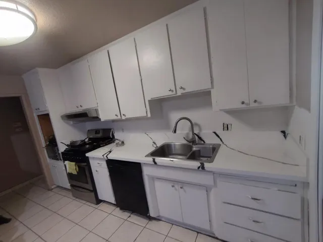 a view of a house with swimming pool and a yard