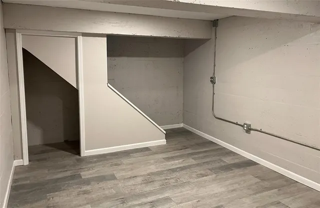 a backyard of a house with barbeque oven and outdoor seating