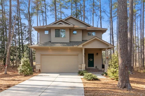 a front view of a house with yard