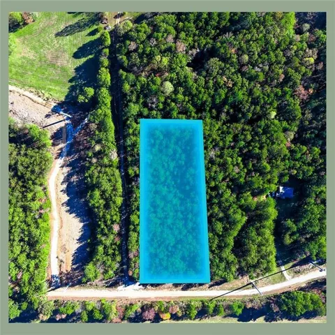 a view of swimming pool with a yard