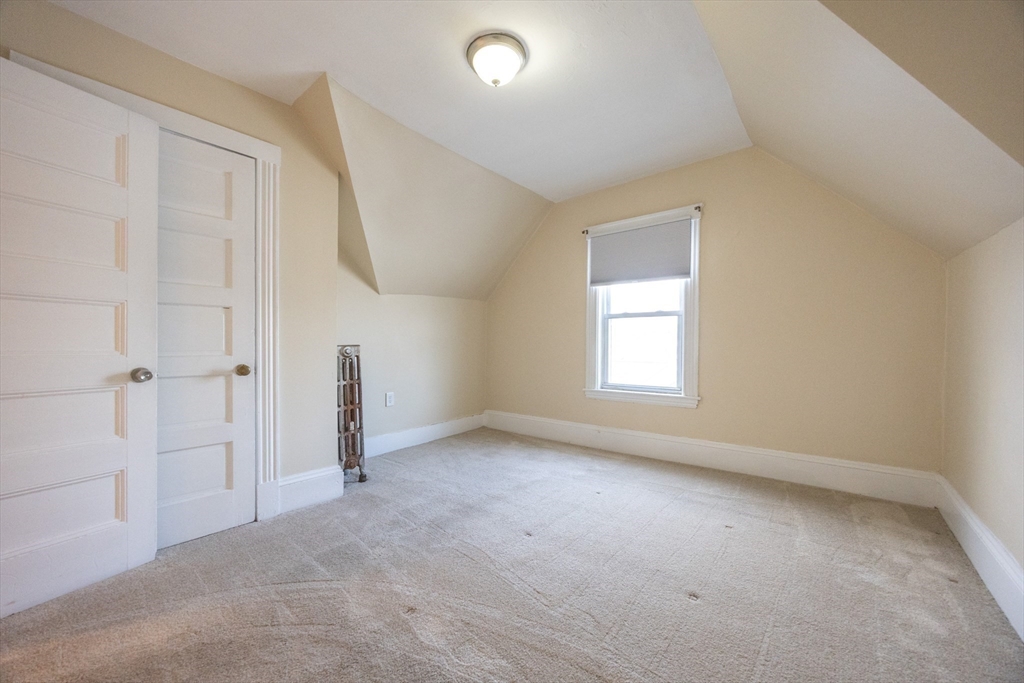 529 Adams Street, Unit 3 Boston, MA 02122 - Photo 6 of 11 an empty room with windows